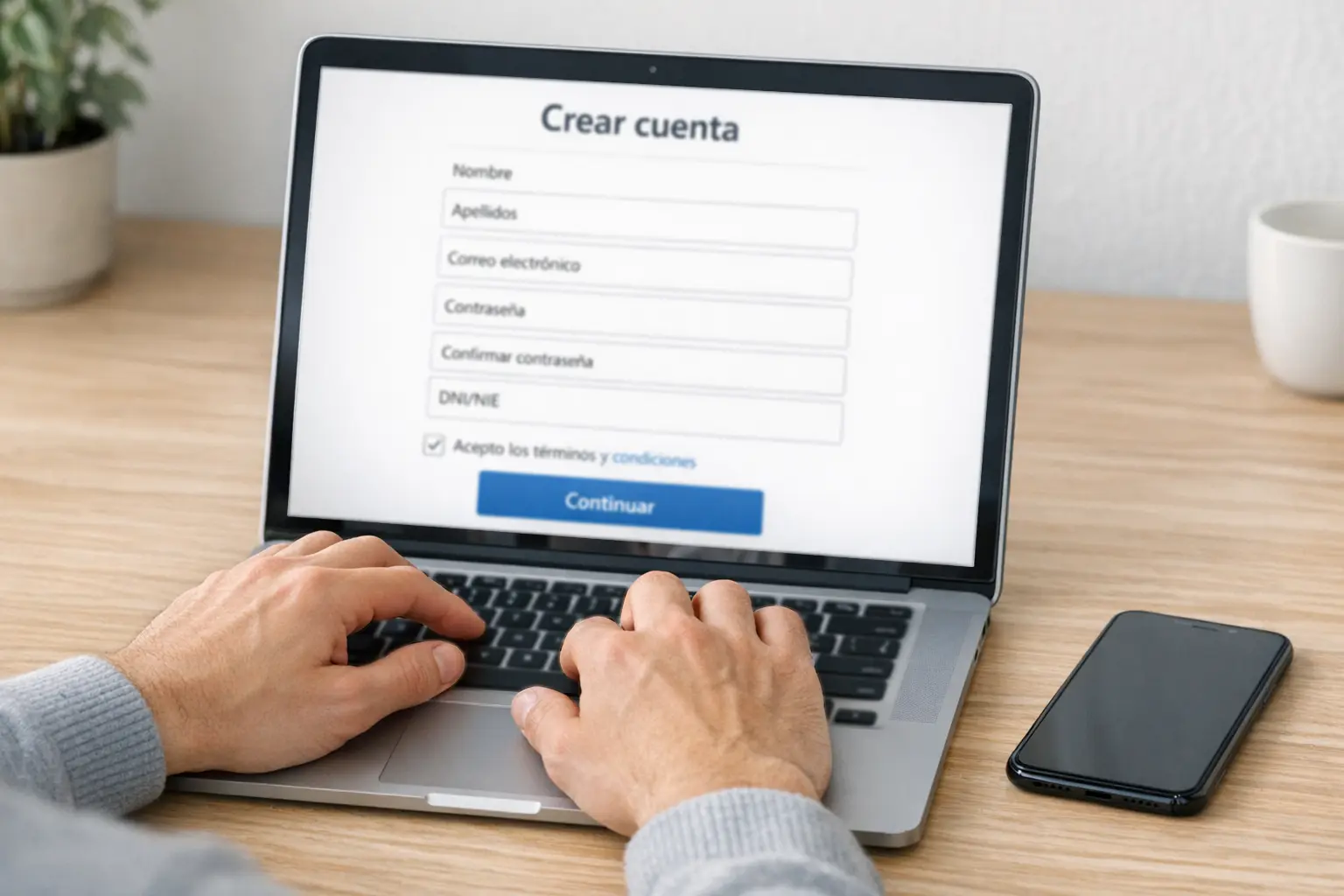 Persona registrándose en casa de apuestas desde ordenador portátil